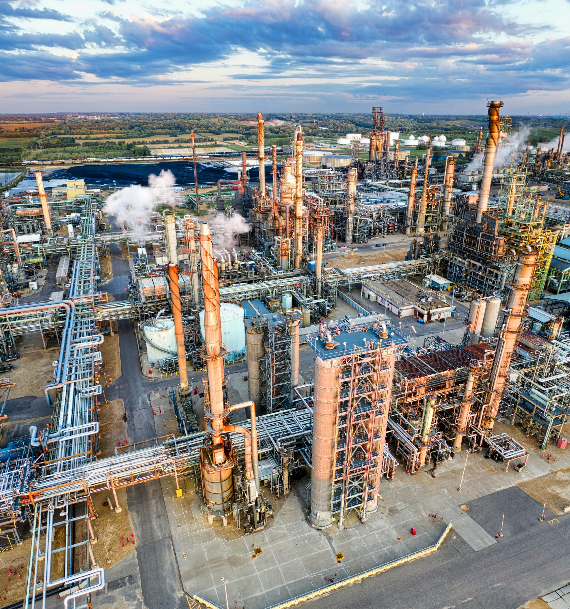 Stunning aerial shot of a large oil refinery in Rosemount, MN during sunset, showcasing industrial complexity.
